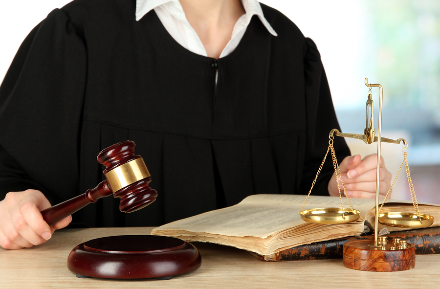 Judge sitting at table during court hearings on room background