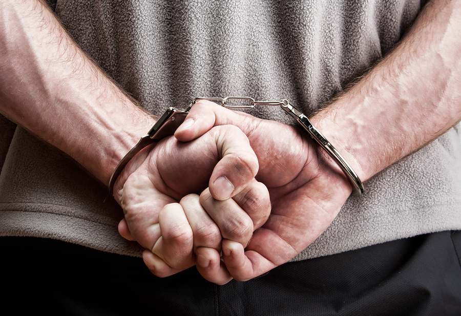 man under arrest in handcuffs